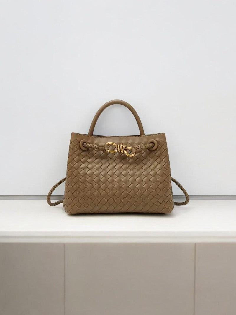 Beige woven leather handbag with gold rope clasp and top handle