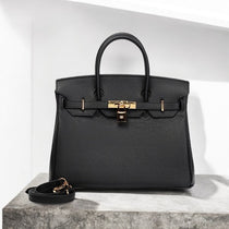 Black leather satchel handbag with gold lock and detachable shoulder strap – Aurora Bags