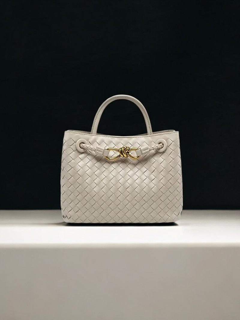 Cream woven leather handbag with gold knot clasp and top handle – luxury designer bag