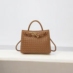 Tan woven leather handbag with gold knot clasp and top handle