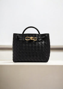 Black woven leather handbag with top handle and gold knot rope detail -Aurora-Bags.com