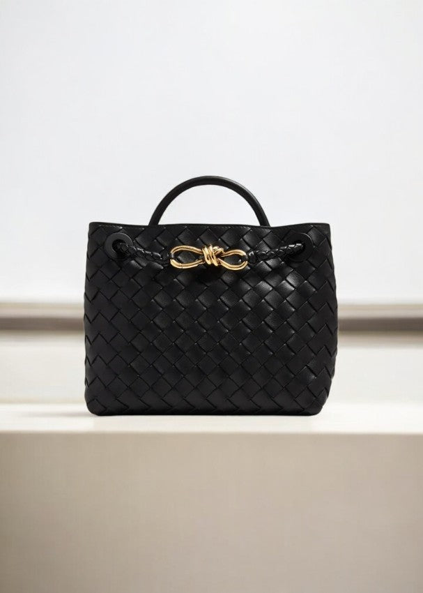Black woven leather handbag with top handle and gold knot rope detail -Aurora-Bags.com