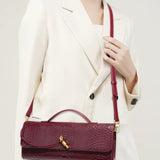 Mira | Snake-Embossed Vegan Leather Clutch – Top Handle & Gold Twist Lock