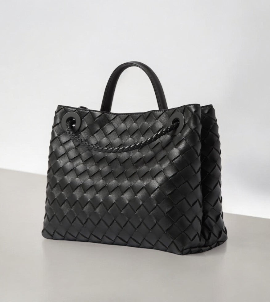 Black woven leather tote bag with braided shoulder strap and top handle - Aurora-bags.com

