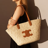 Women's Vintage Straw Woven Tote Bag with Leather Handles and Decorative Emblem