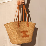 Women's Vintage Straw Woven Tote Bag with Leather Handles and Decorative Emblem