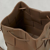 Close-up of intreccio woven lambskin texture in taupe