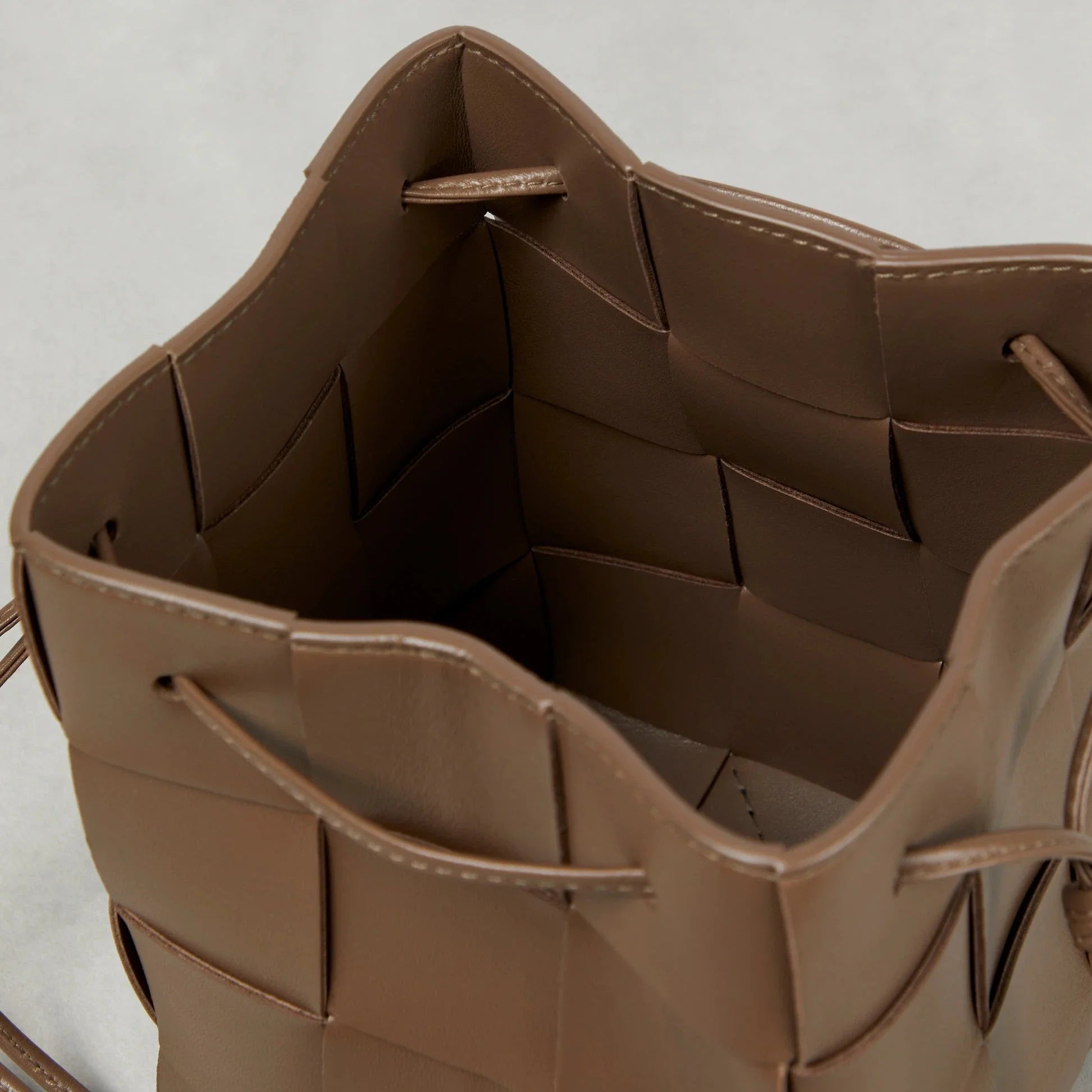 Close-up of intreccio woven lambskin texture in taupe