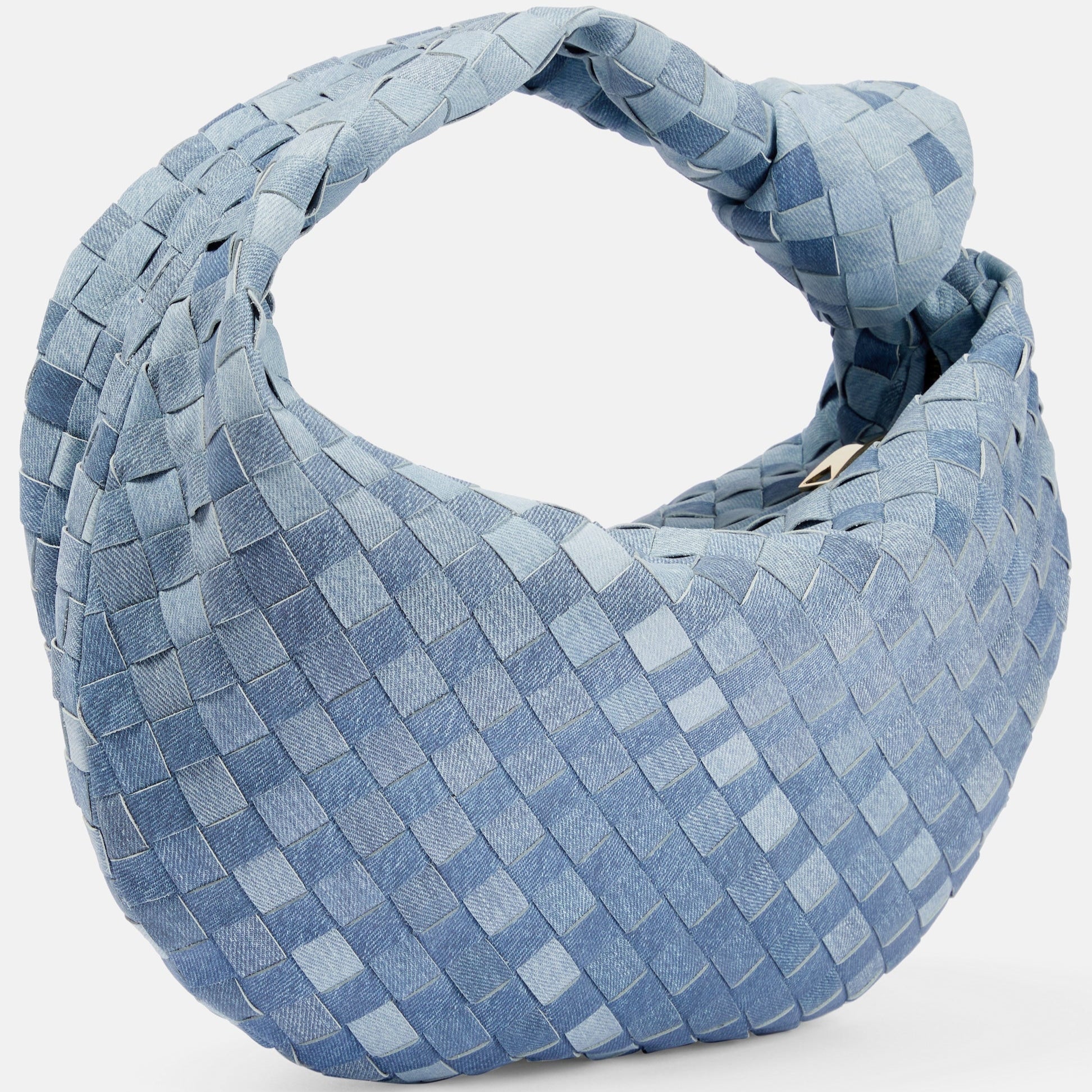 Close-up of woven leather texture on light blue designer hobo bag