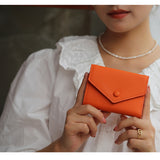 Emma | Orange Pebbled Leather Mini Wallet – Chic & Compact