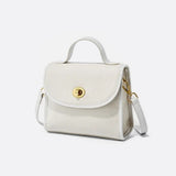 Aurora Signature Trapeze Bag – Structured Handbag with Turn-Lock Closure