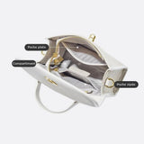 Aurora Signature Trapeze Bag – Structured Handbag with Turn-Lock Closure