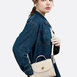 Aurora Signature Trapeze Bag – Structured Handbag with Turn-Lock Closure