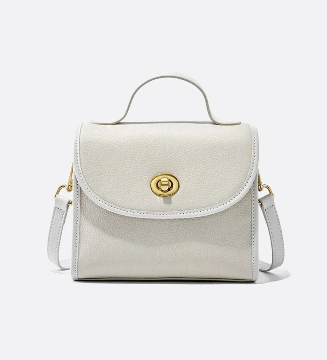 Aurora Signature Trapeze Bag – Structured Handbag with Turn-Lock Closure