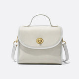 Aurora Signature Trapeze Bag – Structured Handbag with Turn-Lock Closure