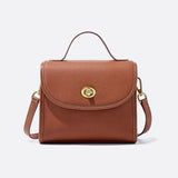 Aurora Signature Trapeze Bag – Structured Handbag with Turn-Lock Closure