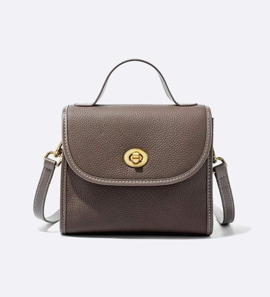 Aurora Signature Trapeze Bag – Structured Handbag with Turn-Lock Closure