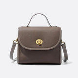 Aurora Signature Trapeze Bag – Structured Handbag with Turn-Lock Closure