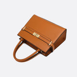 Aurora Signature Trapeze Bag – Structured Handbag with Turn-Lock Closure
