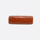 Vintage Leather Handbag with Top Handle and Detachable Strap