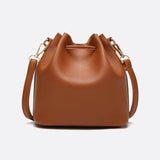 Camel Leather Bucket Bag with Tassels – Chic, Compact & Versatile