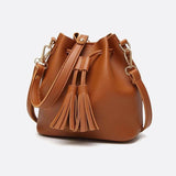 Camel Leather Bucket Bag with Tassels – Chic, Compact & Versatile