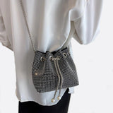 Drawstring bucket bag with rhinestones and chain strap